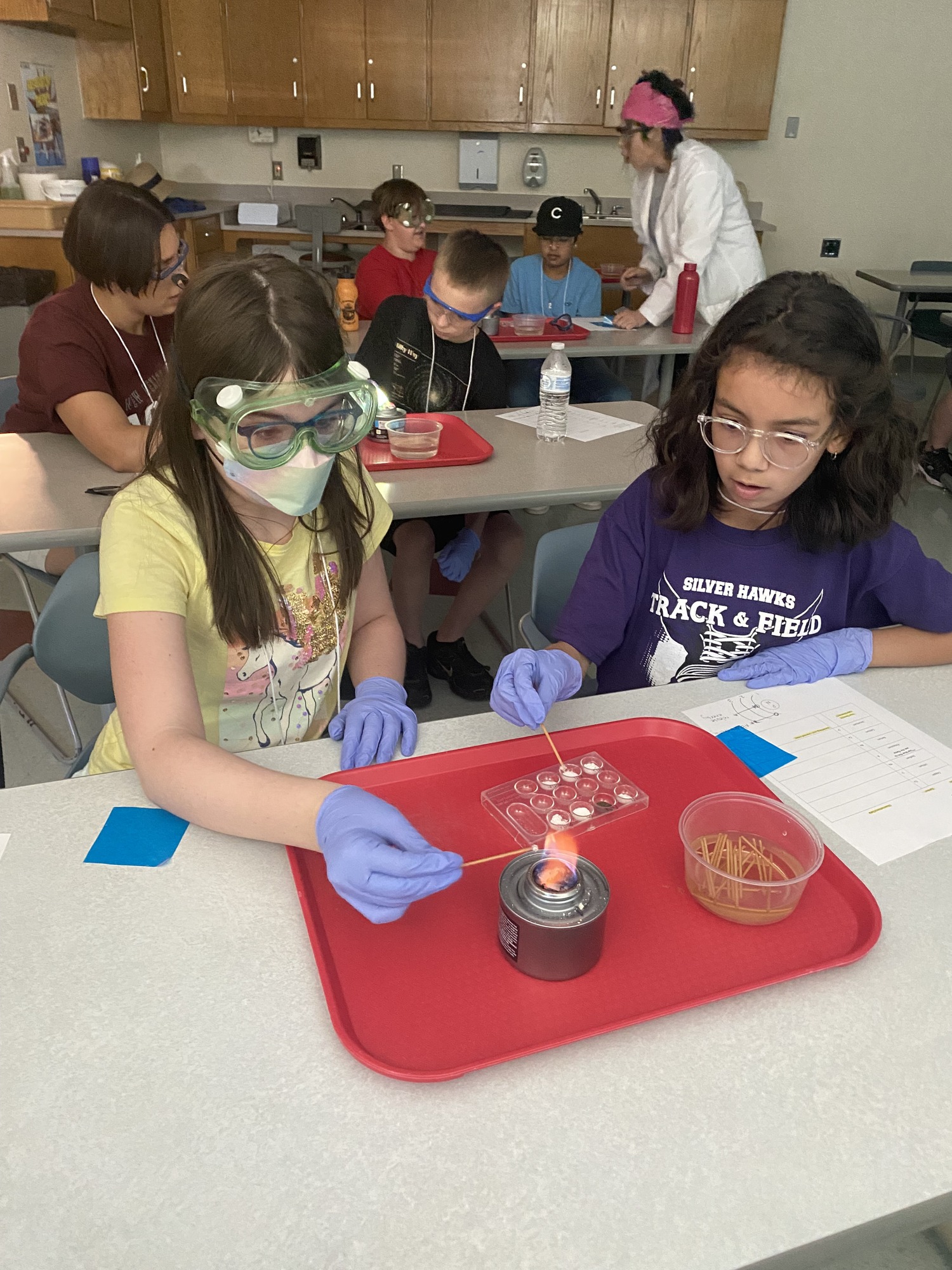 Campers conducting experiment in a science lab